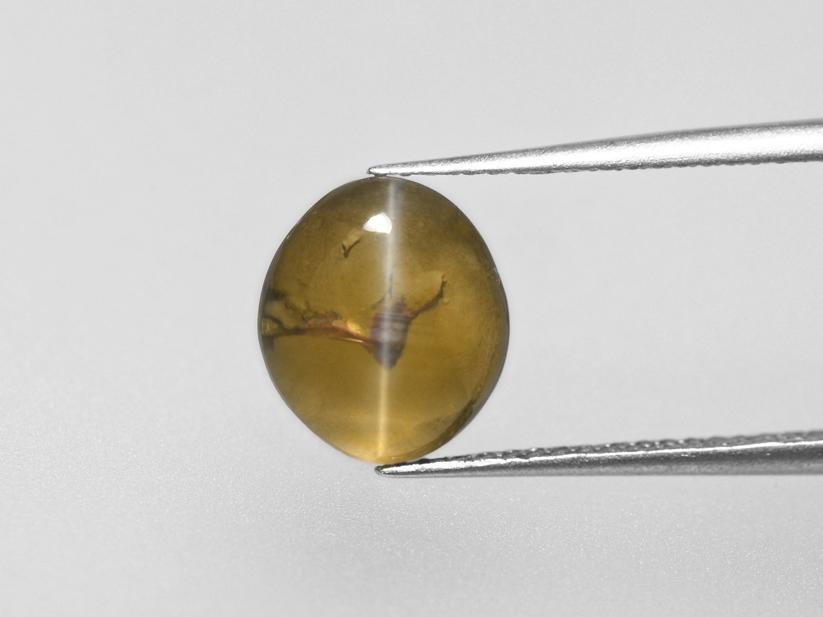 8800326-cabochon-honey-igi-madagascar-natural-chrysoberyl-cat's-eye-3.10-ct