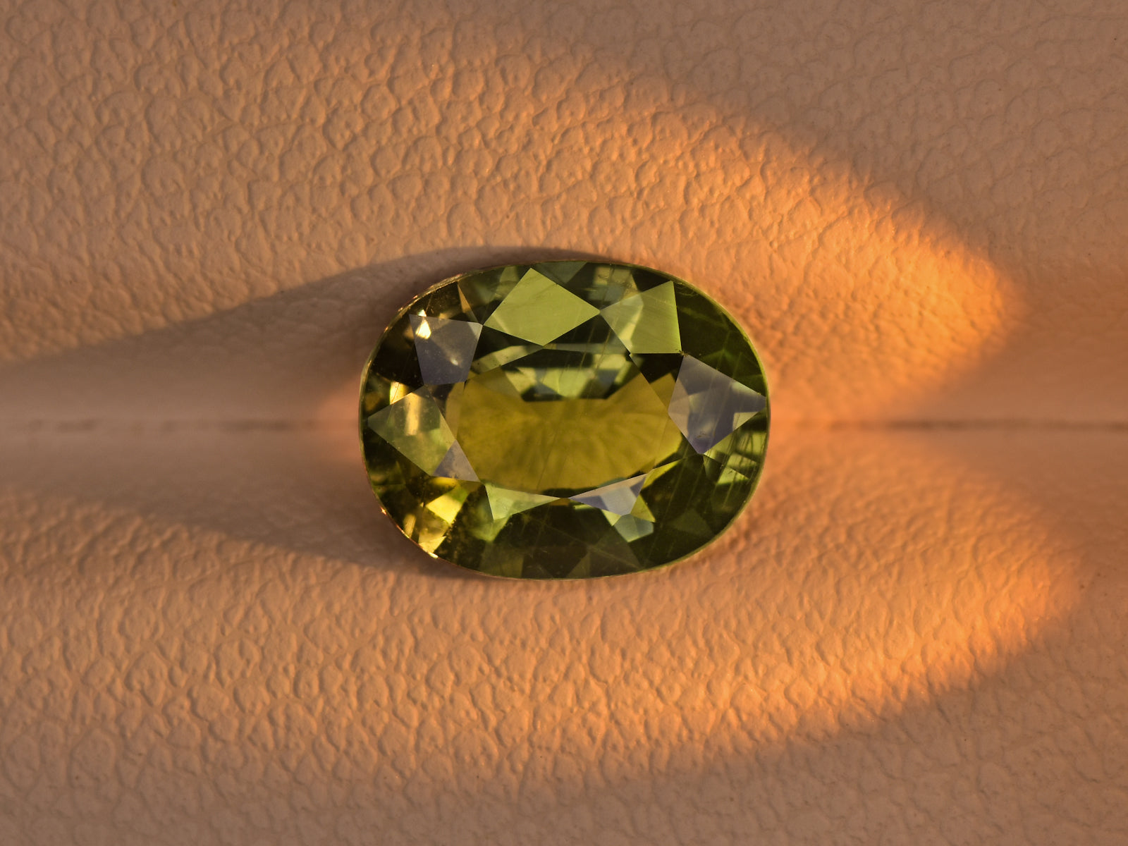 8800655-oval-olive-green-changing-to-yellowish-green-aigs-madagascar-natural-color-change-sapphire-2.30-ct