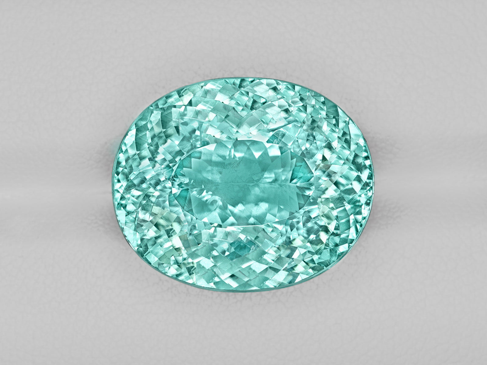 8803115-oval-fiery-neon-greenish-blue-igi-mozambique-natural-paraiba-tourmaline-22.38-ct
