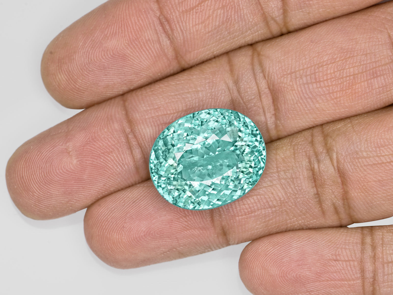 8803115-oval-fiery-neon-greenish-blue-igi-mozambique-natural-paraiba-tourmaline-22.38-ct