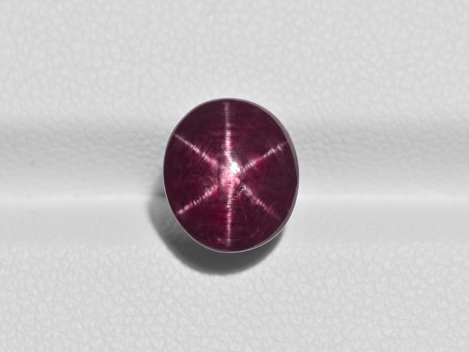8800964-cabochon-dark-purplish-red-igi-india-natural-star-ruby-6.07-ct