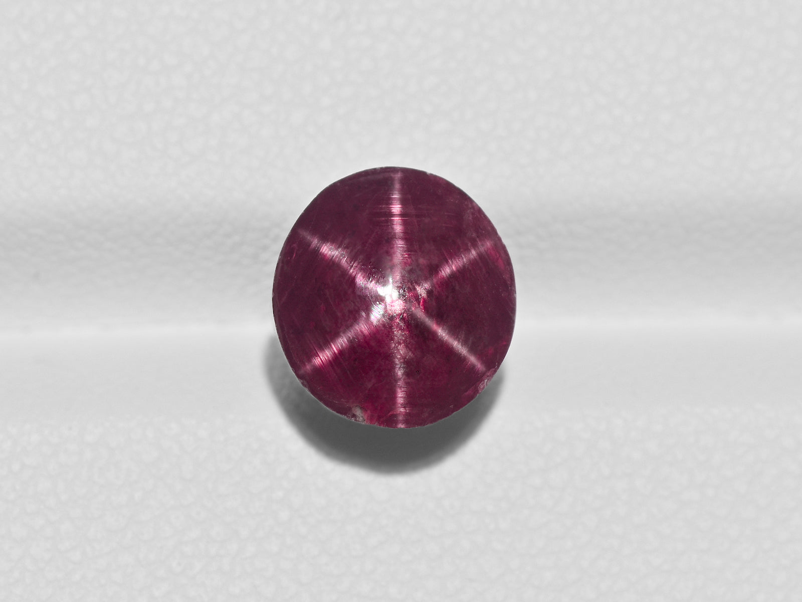 8800966-cabochon-dark-purplish-red-igi-india-natural-star-ruby-6.77-ct