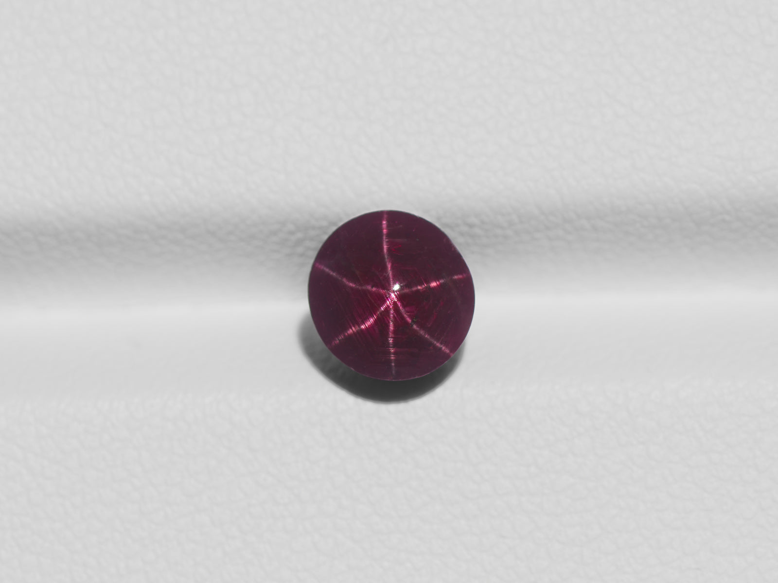 8800958-cabochon-dark-purple-red-igi-india-natural-star-ruby-3.03-ct