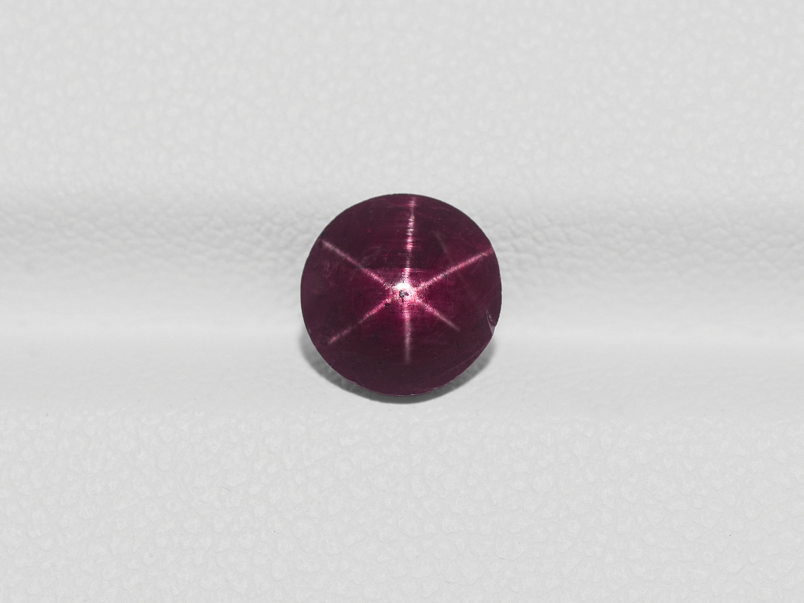 8800961-cabochon-dark-purple-red-igi-india-natural-star-ruby-2.09-ct