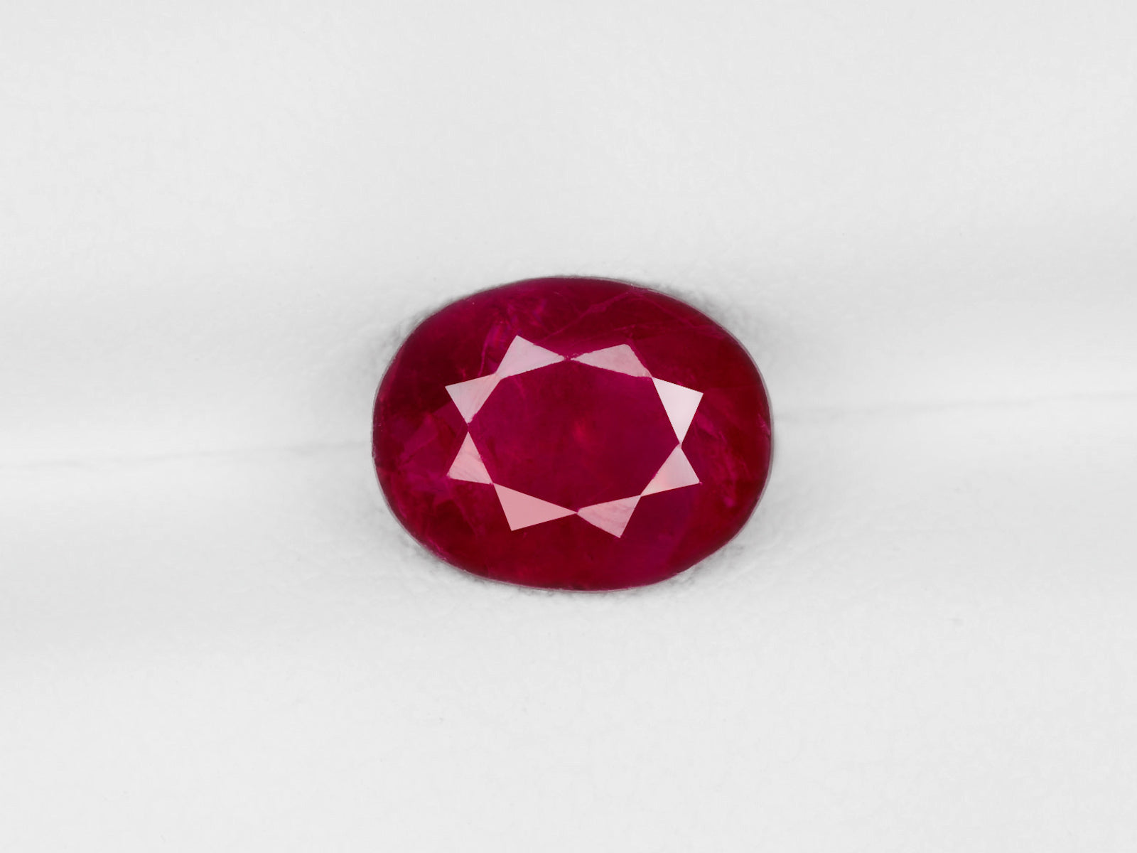 8800449-oval-deep-pinkish-red-igi-burma-natural-ruby-1.69-ct