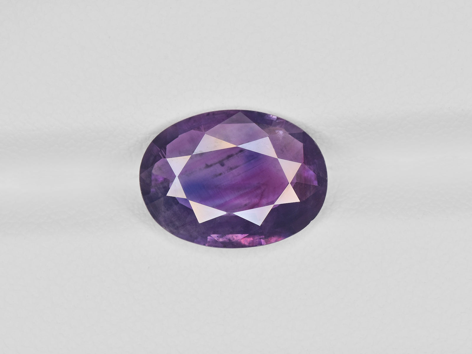 8800669-oval-deep-purple-pink-with-blue-patches-igi-pakistan-natural-other-fancy-sapphire-3.62-ct