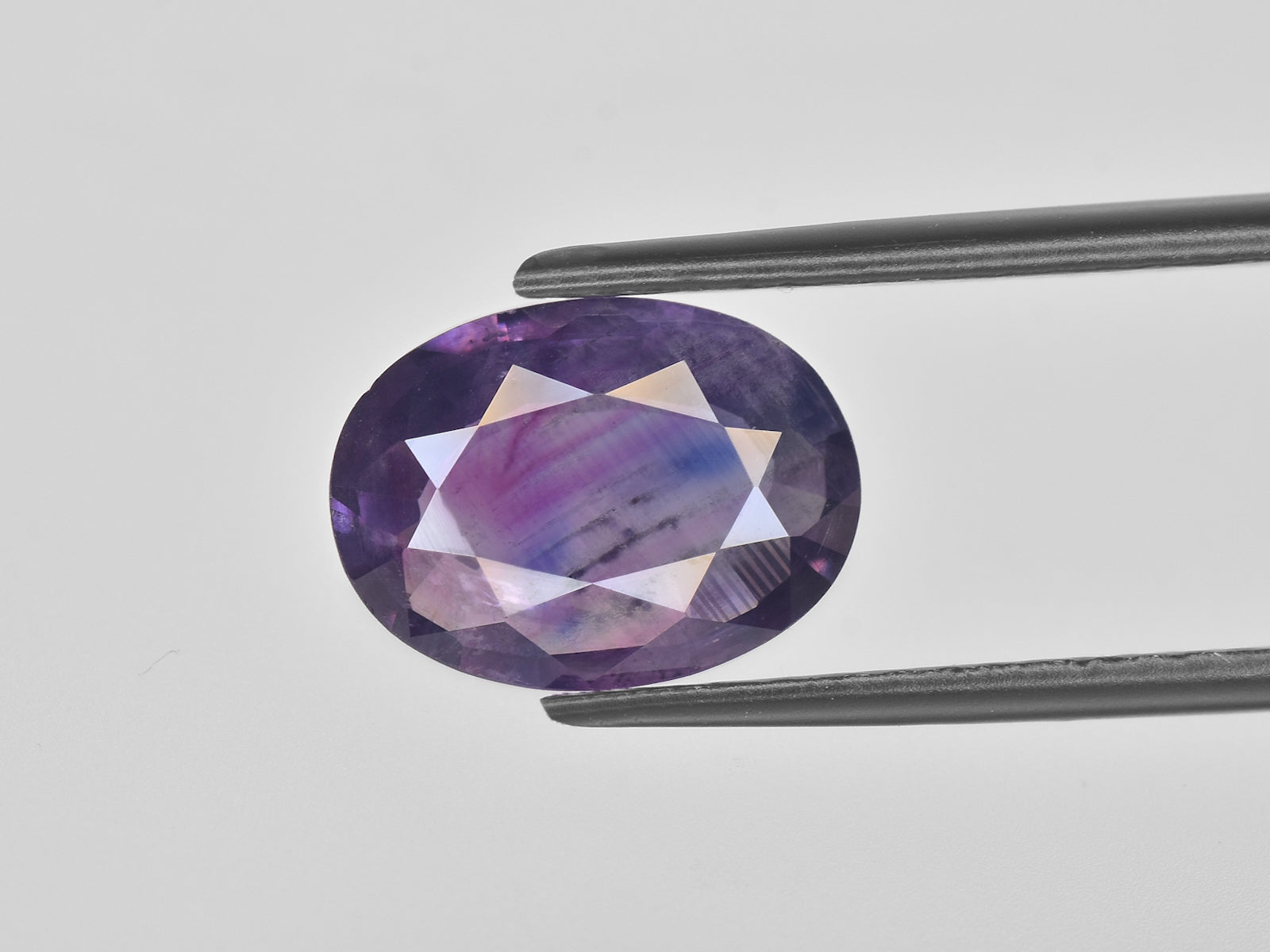 8800669-oval-deep-purple-pink-with-blue-patches-igi-pakistan-natural-other-fancy-sapphire-3.62-ct
