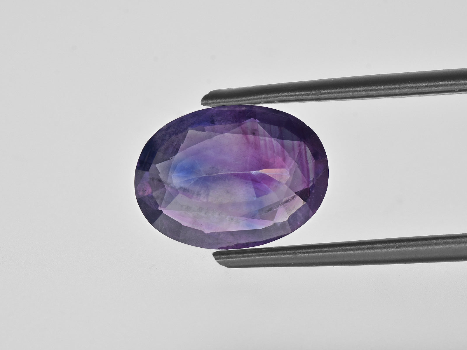8800669-oval-deep-purple-pink-with-blue-patches-igi-pakistan-natural-other-fancy-sapphire-3.62-ct