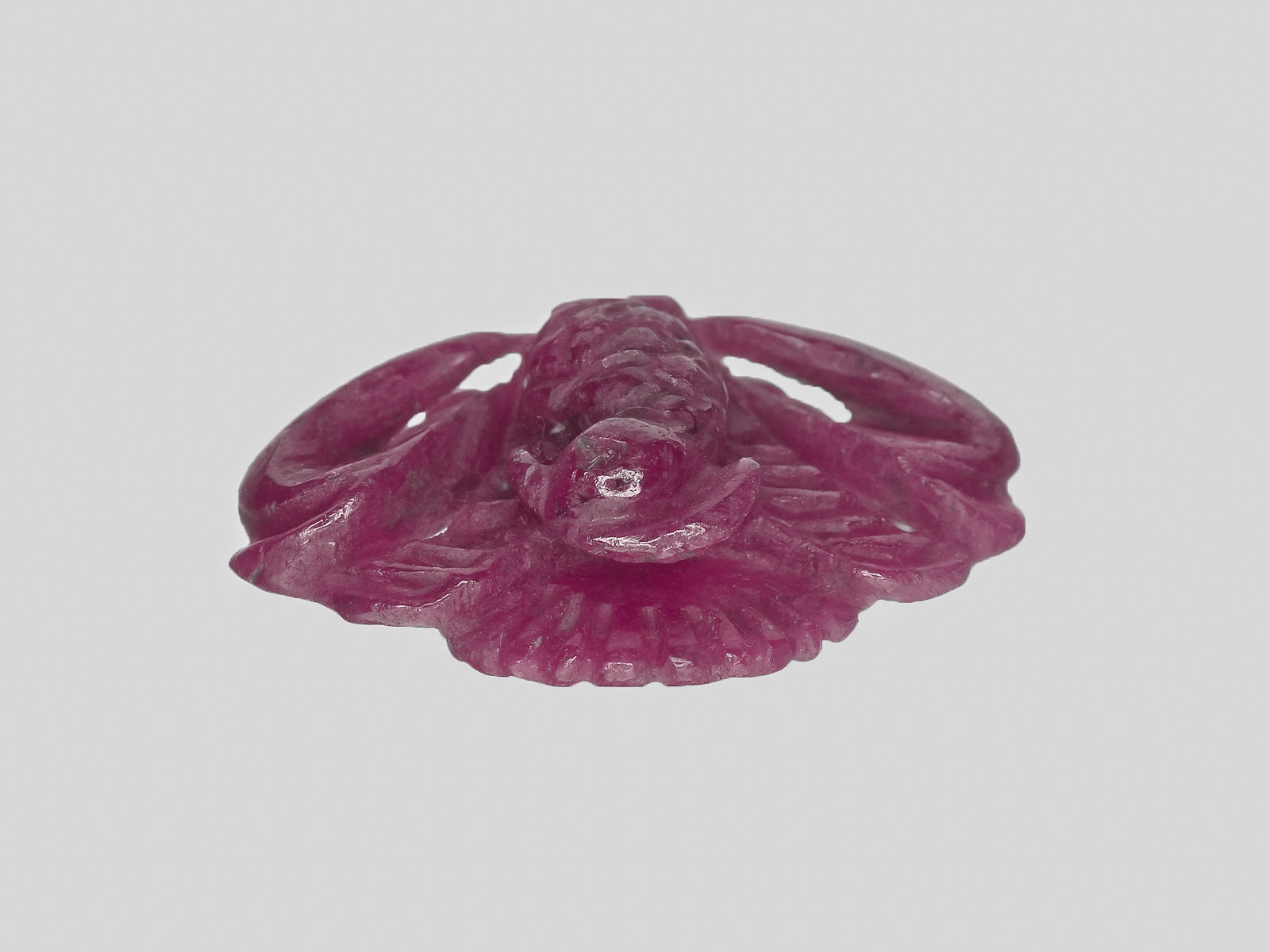 8801147-carved-maroonish-red-gii-india-natural-ruby-21.68-ct