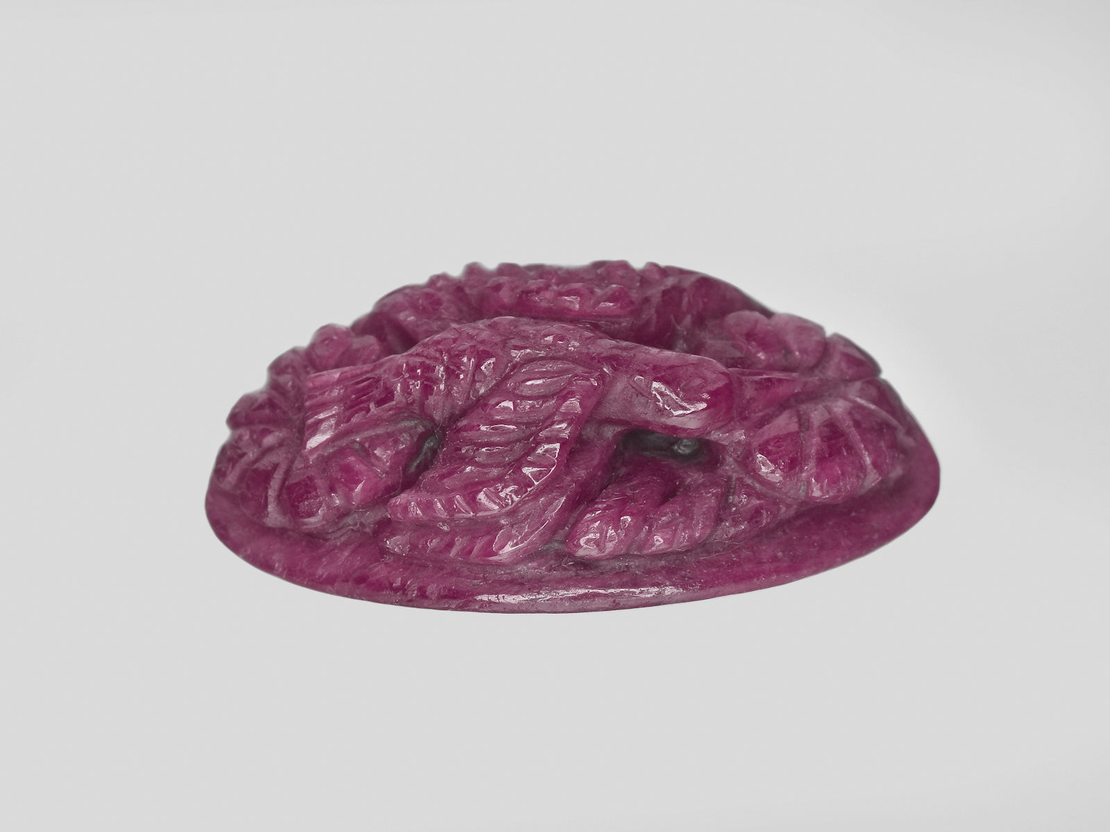 8801146-carved-maroonish-red-gii-india-natural-ruby-55.32-ct