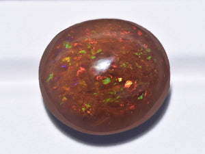 8801110-cabochon-dark-brown-with-green-&-orange-flashes-gii-ethiopia-natural-black-opal-35.60-ct