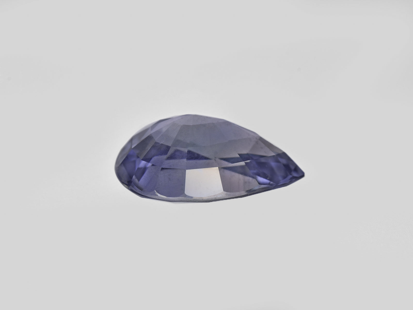 8801741-pear-greyish-violet-changing-to-deep-violet-aigs-tanzania-natural-color-change-sapphire-7.20-ct