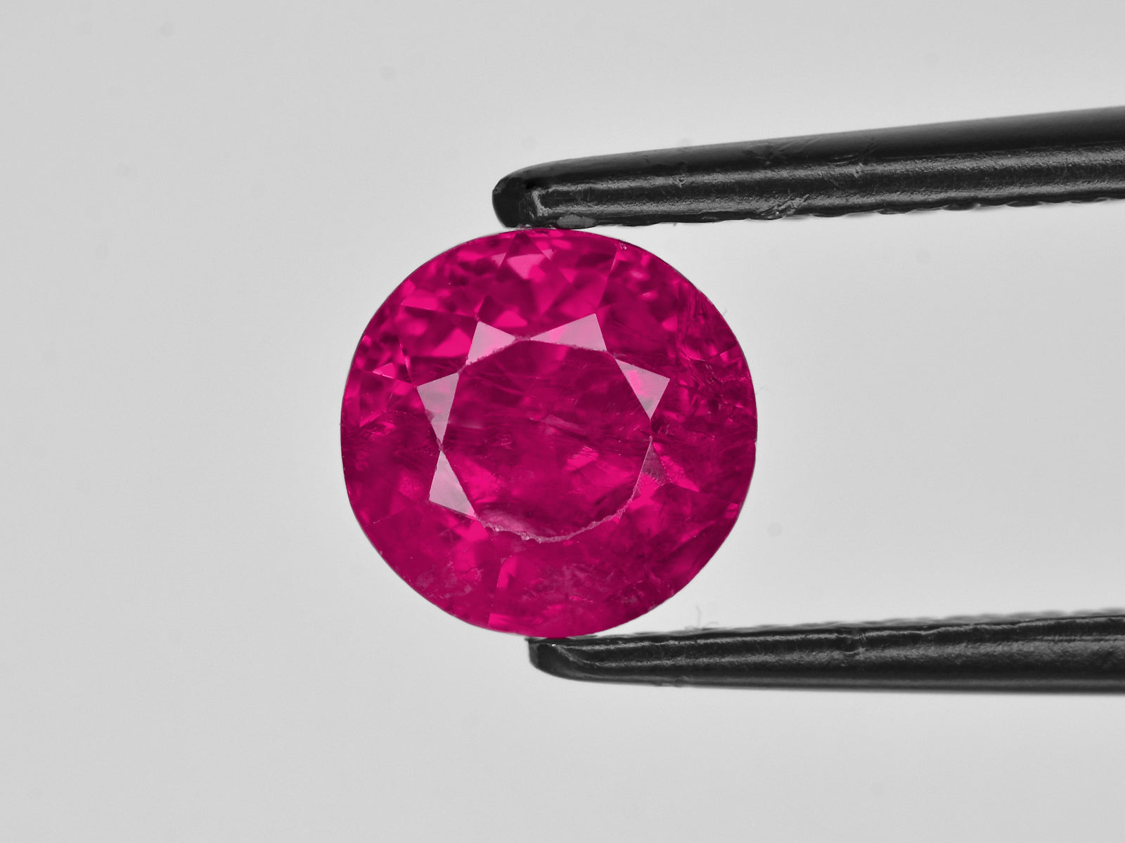8801477-round-lustrous-vivid-pinkish-red-gia-burma-natural-ruby-2.11-ct