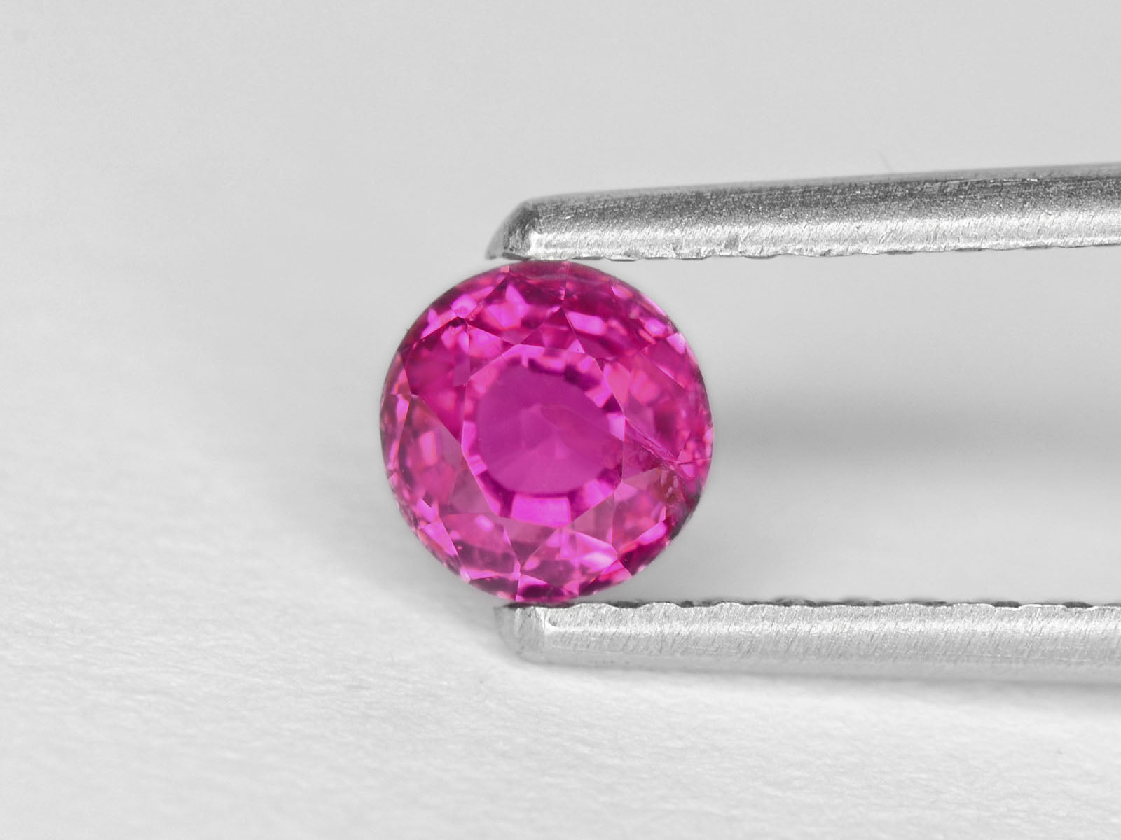 8800302-round-fiery-neon-pinkish-red-igi-madagascar-natural-ruby-1.15-ct