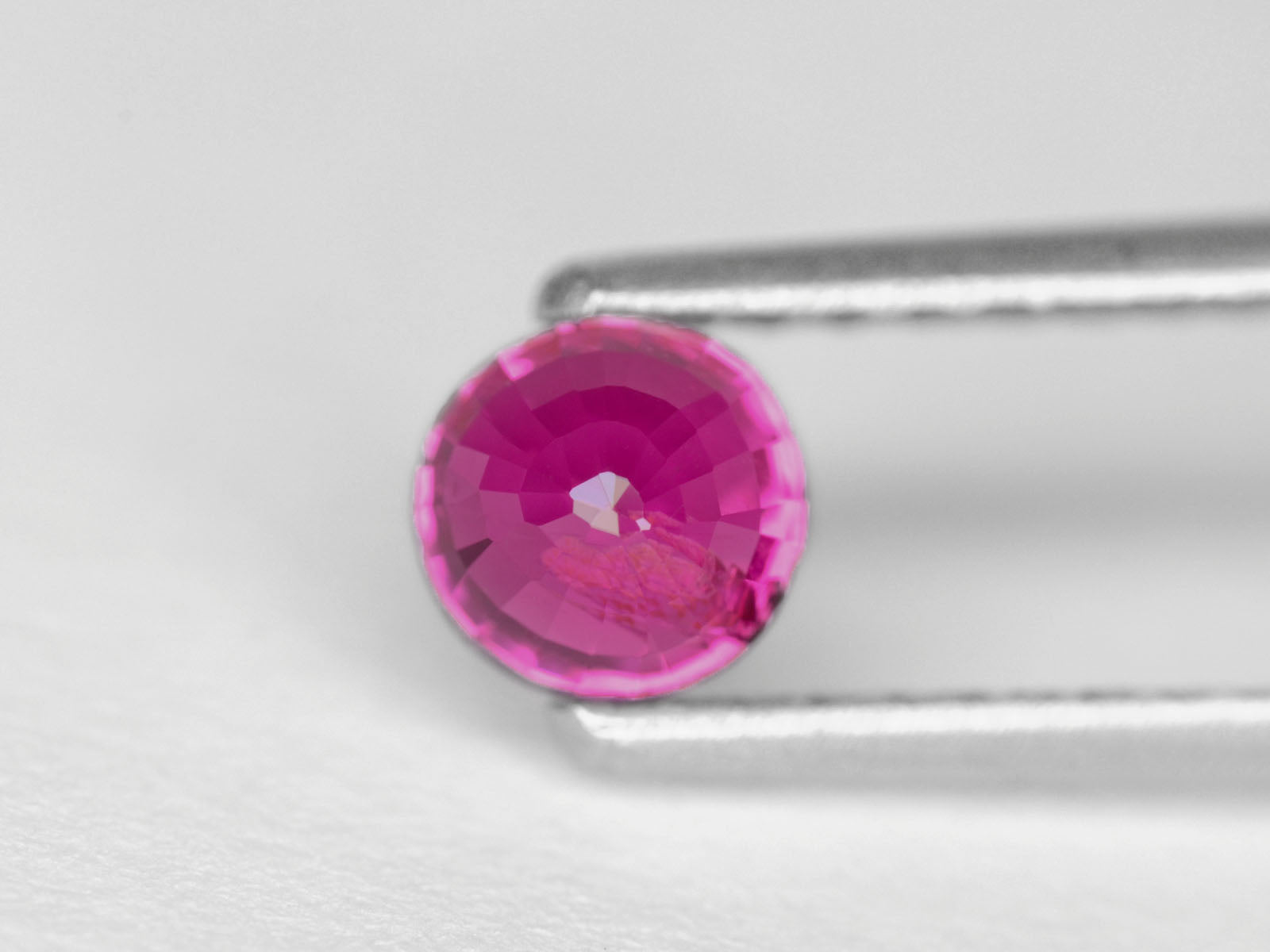 8800302-round-fiery-neon-pinkish-red-igi-madagascar-natural-ruby-1.15-ct