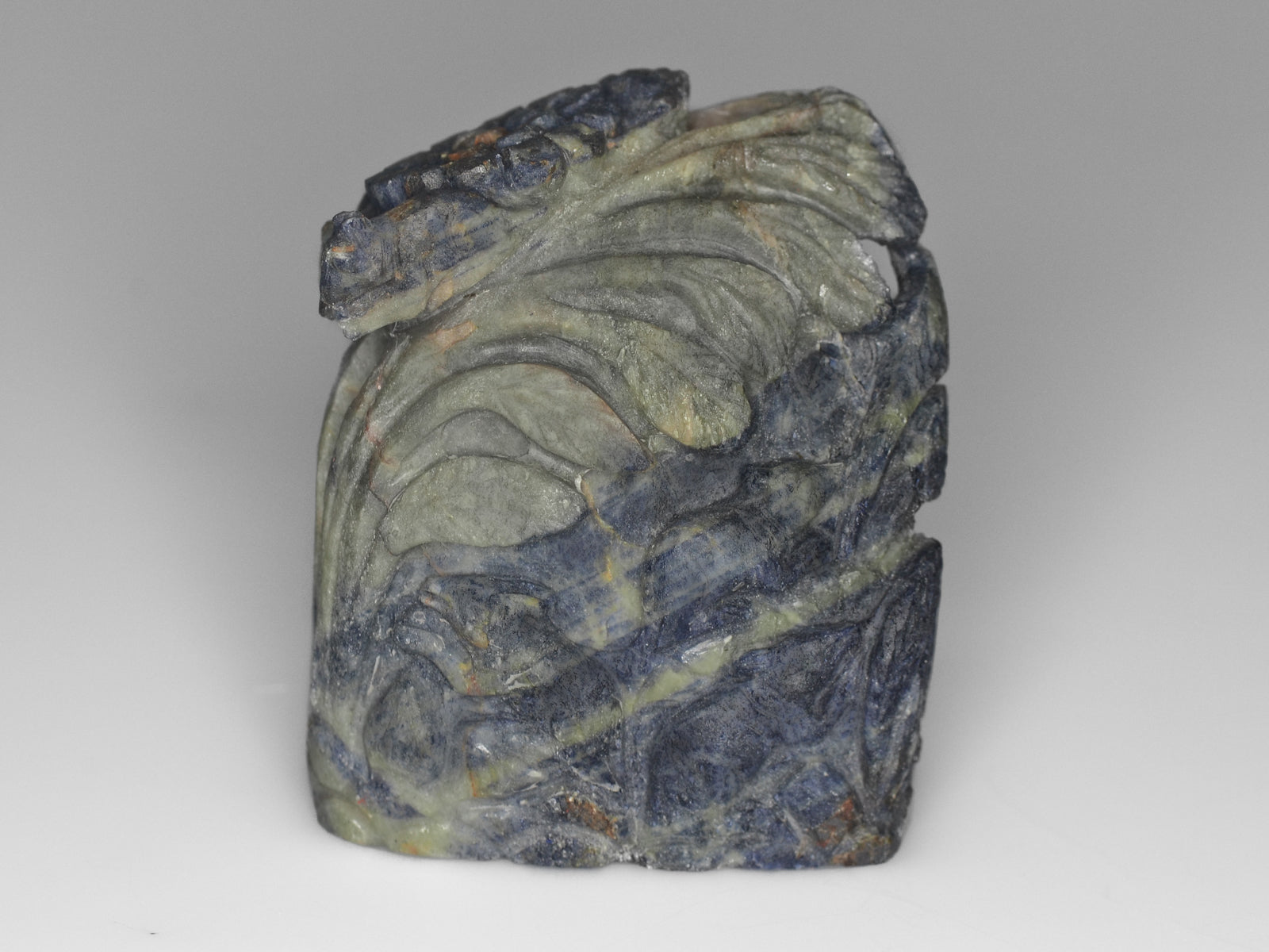 8800840-carved-blue-&-greyish-green-bi-color-gii-sierra-leone-natural-blue-sapphire-1808.90-ct