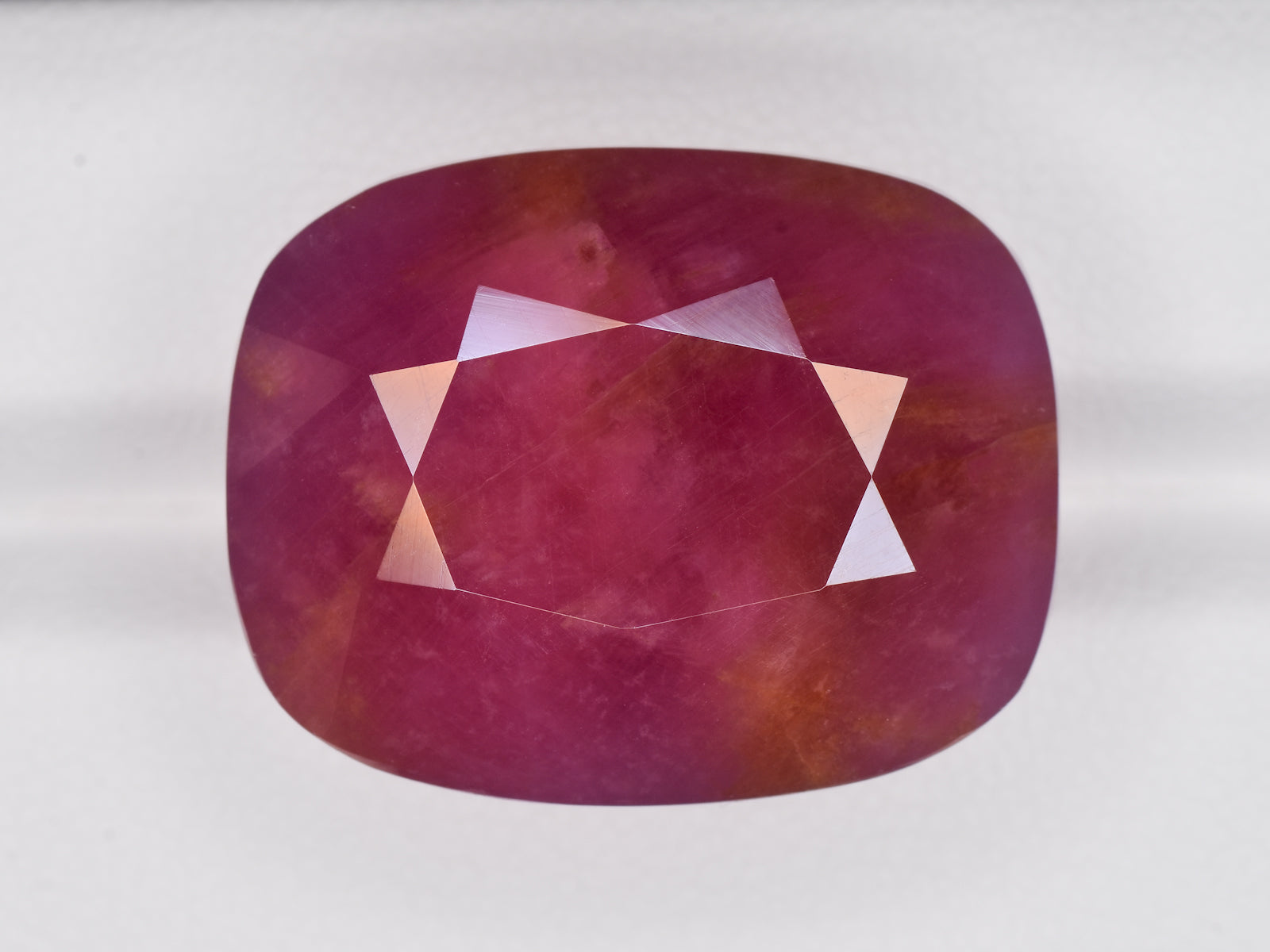 8801202-cushion-pinkish-red-with-orange-staining-gii-liberia-natural-ruby-65.38-ct