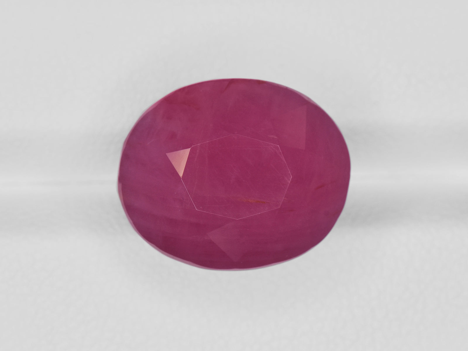 8801205-oval-pinkish-red-gii-guinea-natural-ruby-23.00-ct