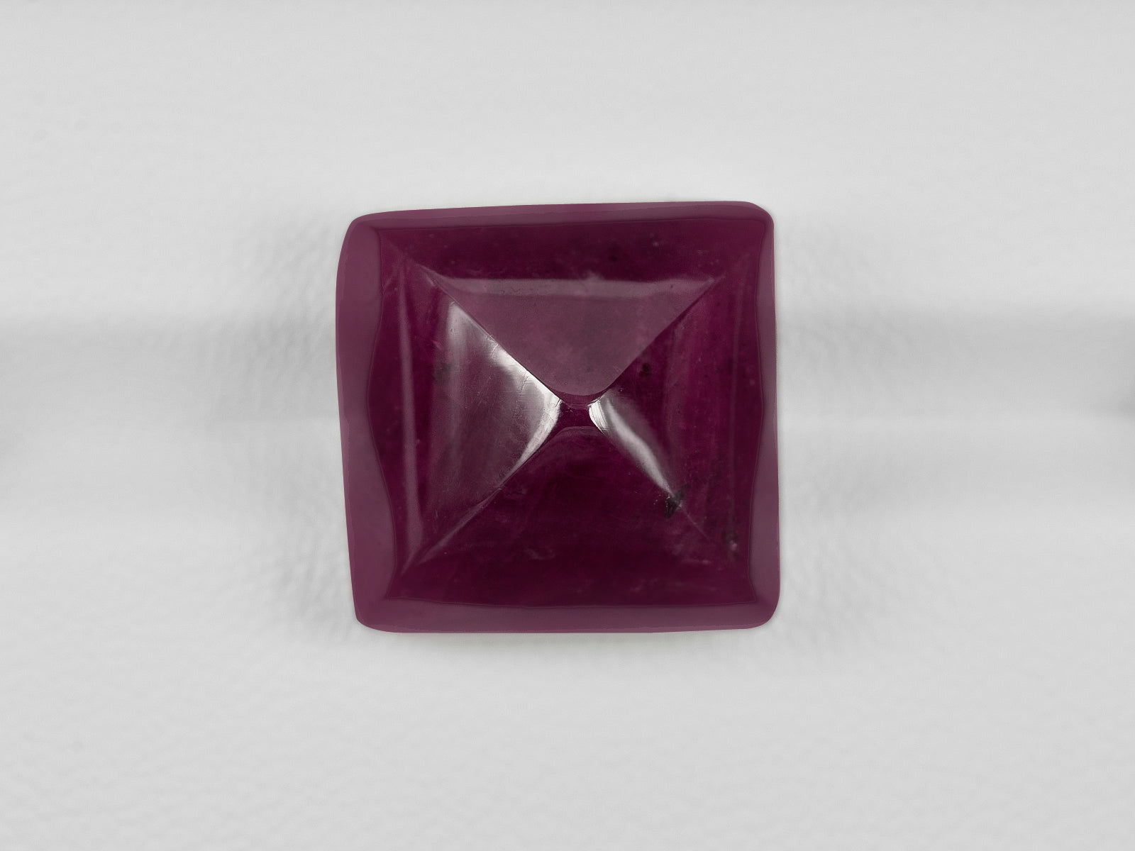 8801237-cabochon-dark-purple-red-gii-liberia-natural-ruby-31.21-ct