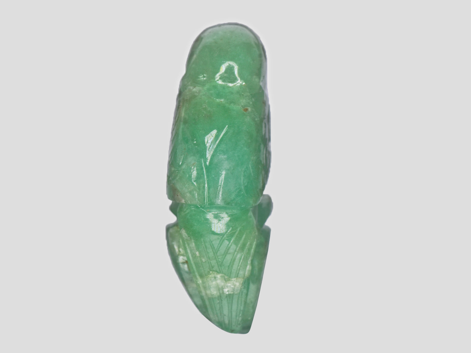 8801539-carved-green-&-red-gii-zambia-natural-emerald-14.83-ct