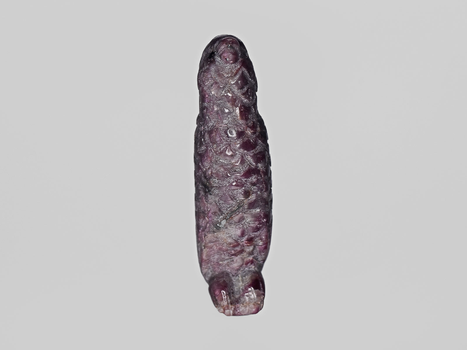 8801457-carved-dark-purple-red-gii-sierra-leone-natural-ruby-46.04-ct