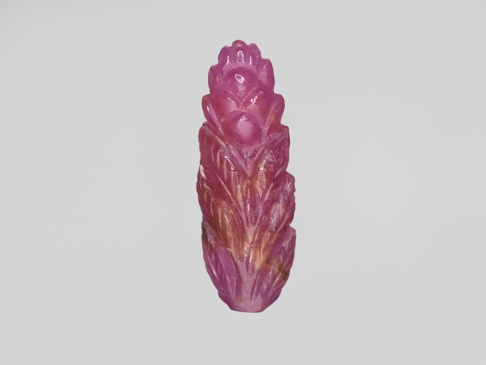 8801542-carved-pinkish-red-gii-guinea-natural-ruby-18.10-ct
