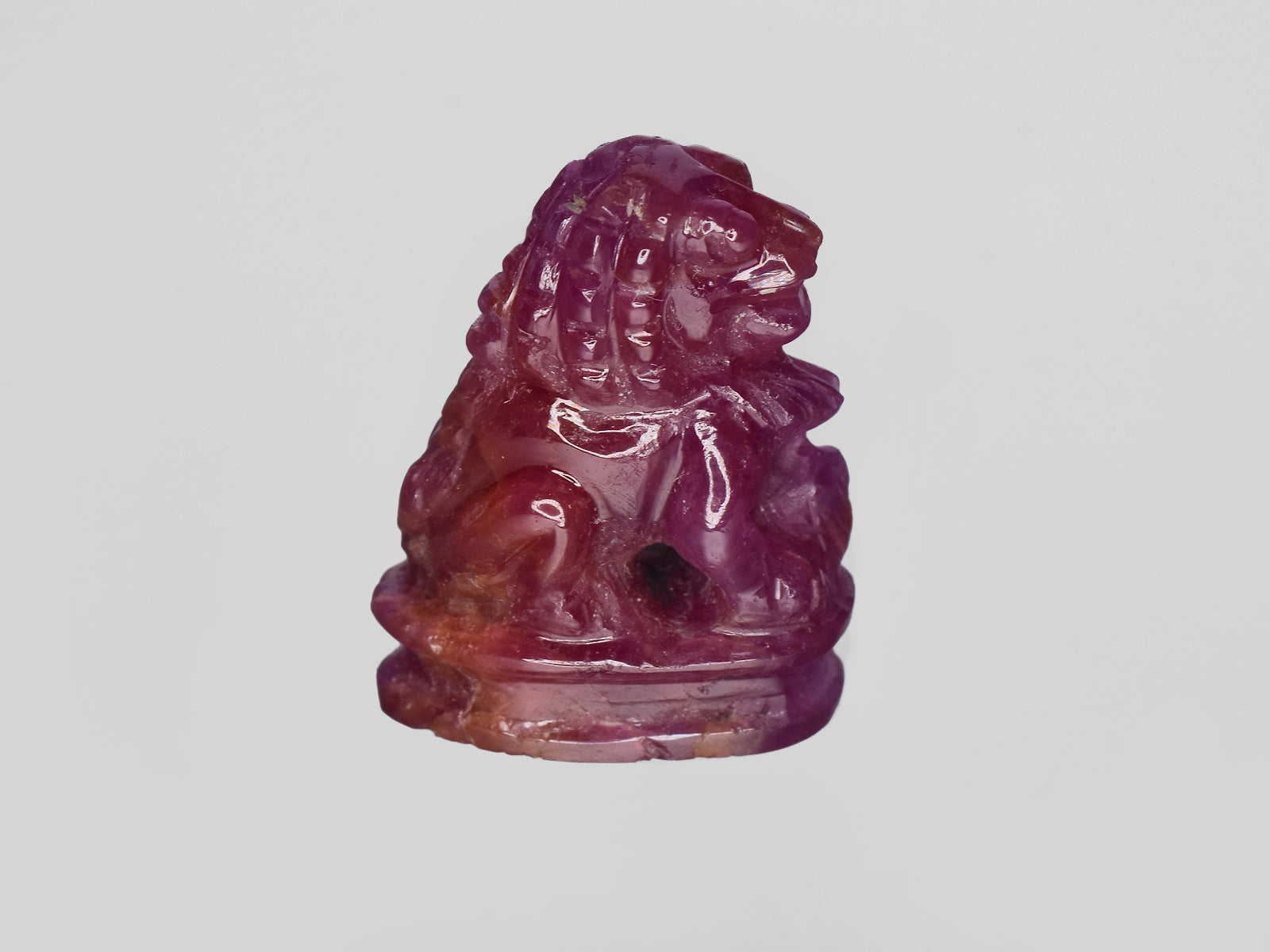 8801458-carved-glossy-pinkish-red-gii-guinea-natural-ruby-35.47-ct