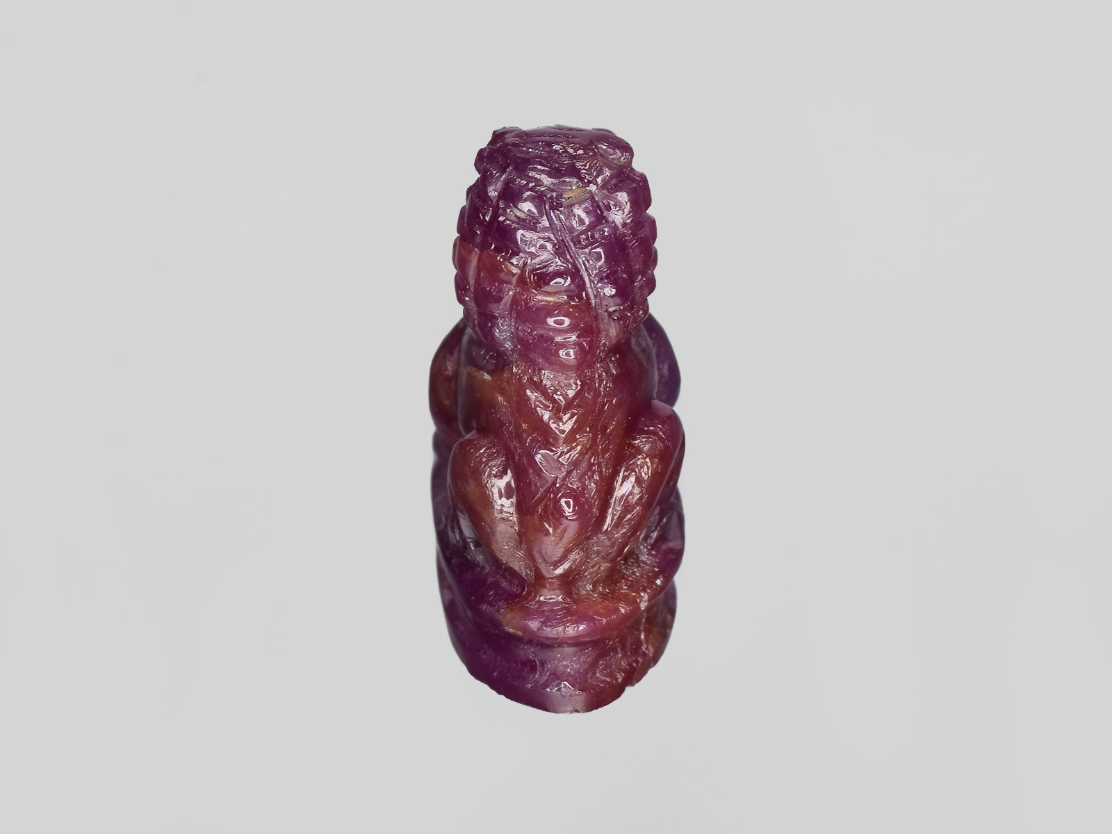 8801458-carved-glossy-pinkish-red-gii-guinea-natural-ruby-35.47-ct