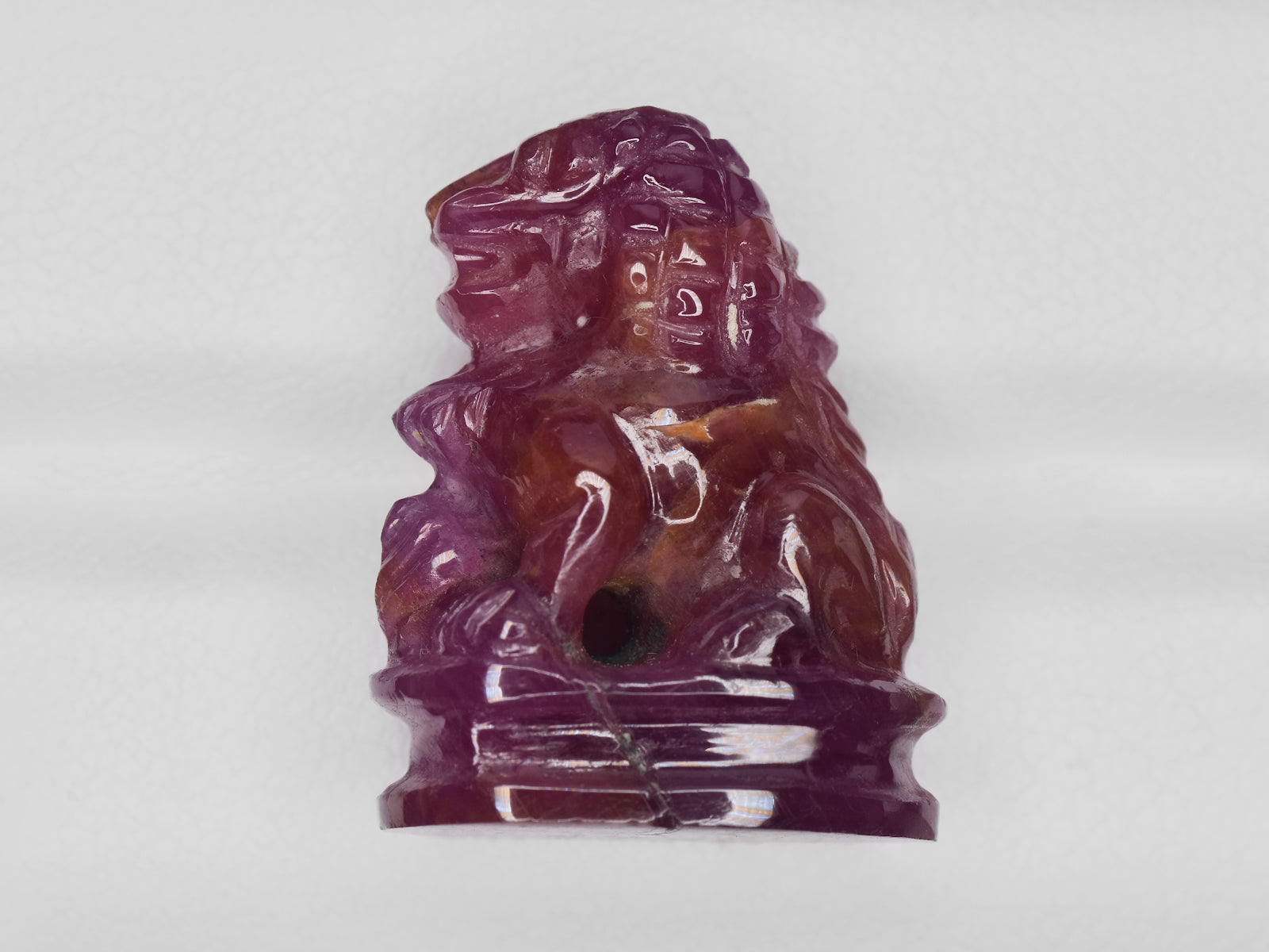 8801458-carved-glossy-pinkish-red-gii-guinea-natural-ruby-35.47-ct