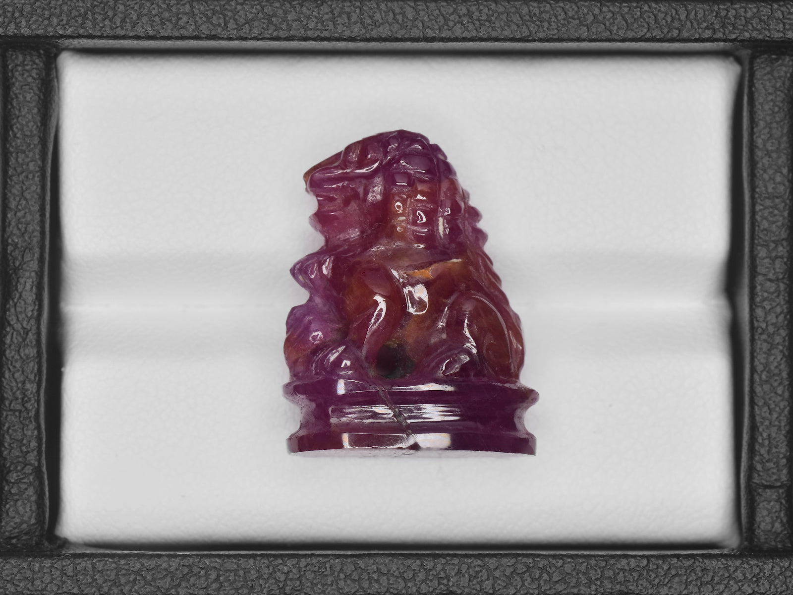 8801458-carved-glossy-pinkish-red-gii-guinea-natural-ruby-35.47-ct