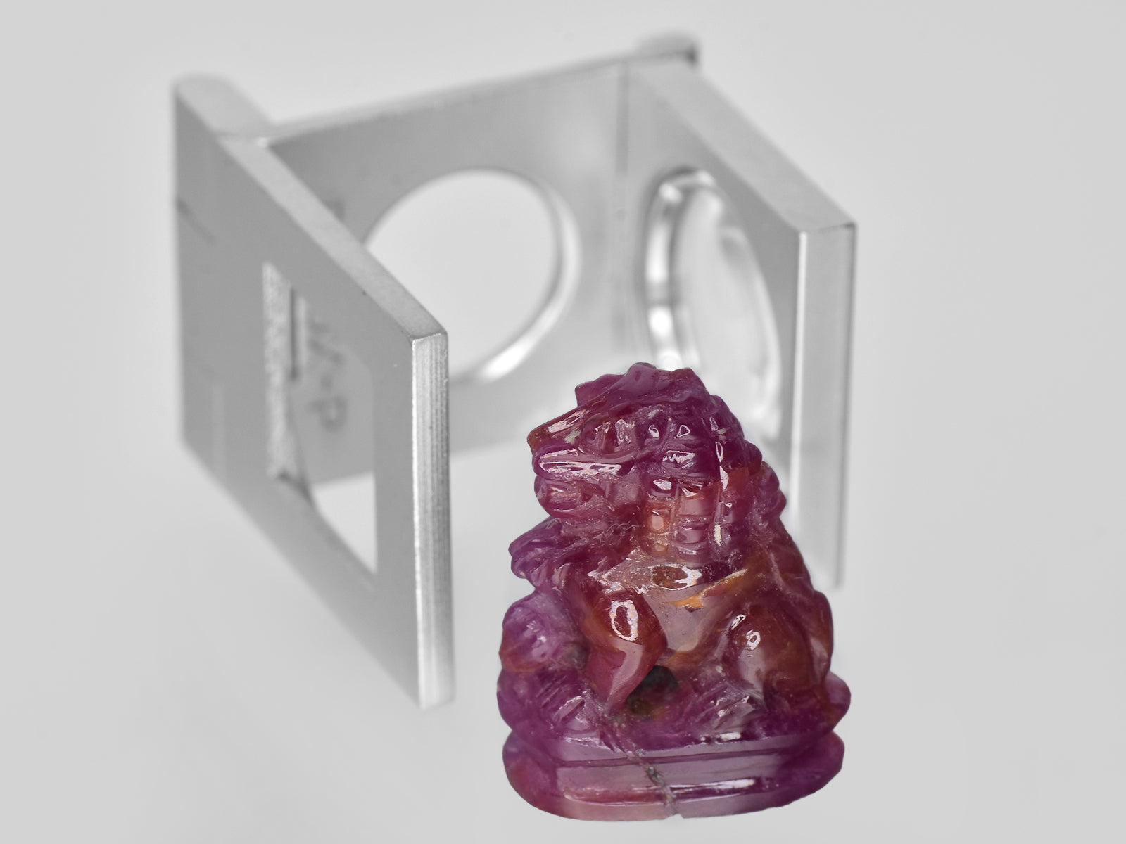 8801458-carved-glossy-pinkish-red-gii-guinea-natural-ruby-35.47-ct