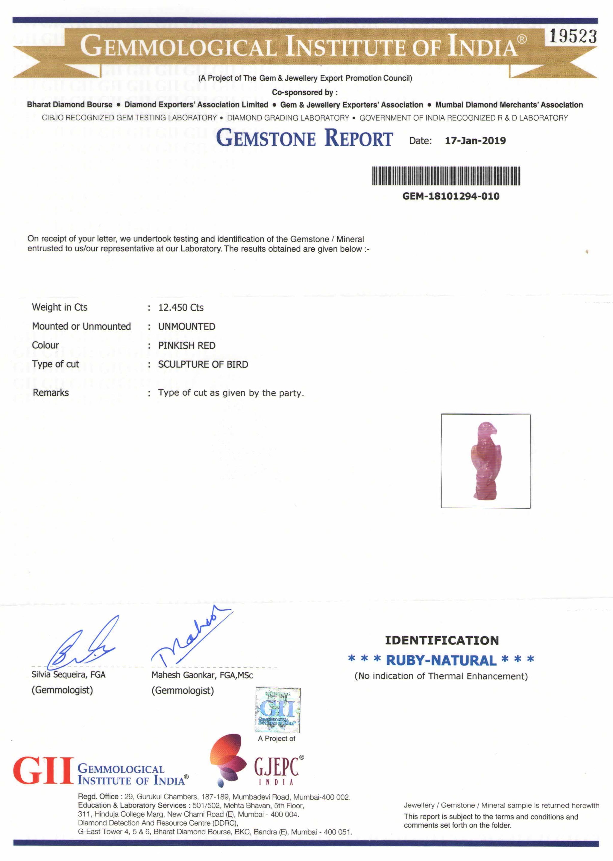 8801543-carved-pinkish-red-gii-guinea-natural-ruby-12.45-ct