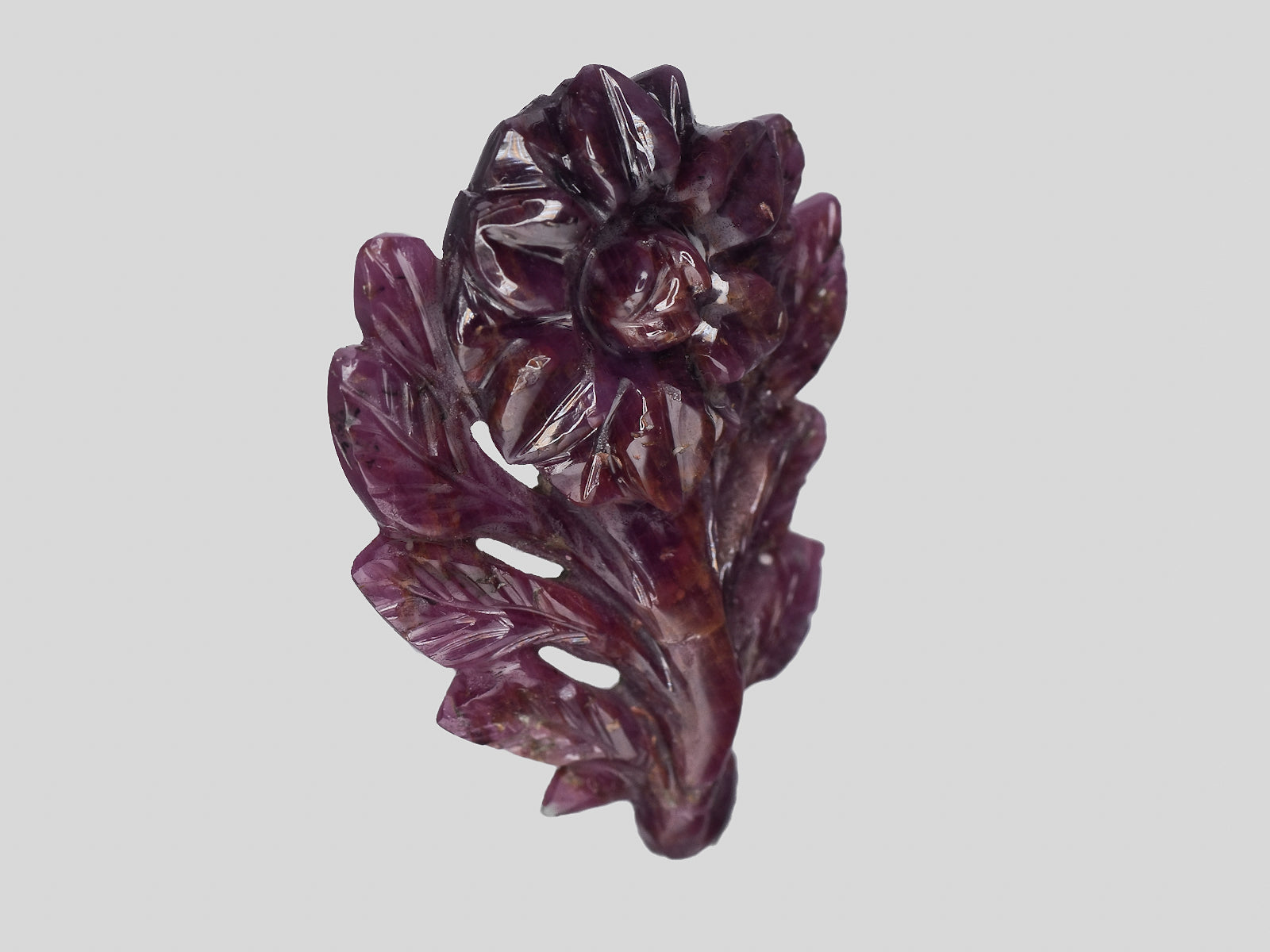 8801544-carved-dark-purple-red-gii-liberia-natural-ruby-28.30-ct