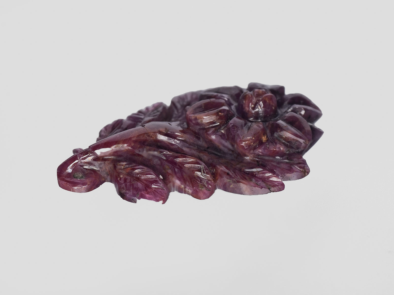 8801544-carved-dark-purple-red-gii-liberia-natural-ruby-28.30-ct