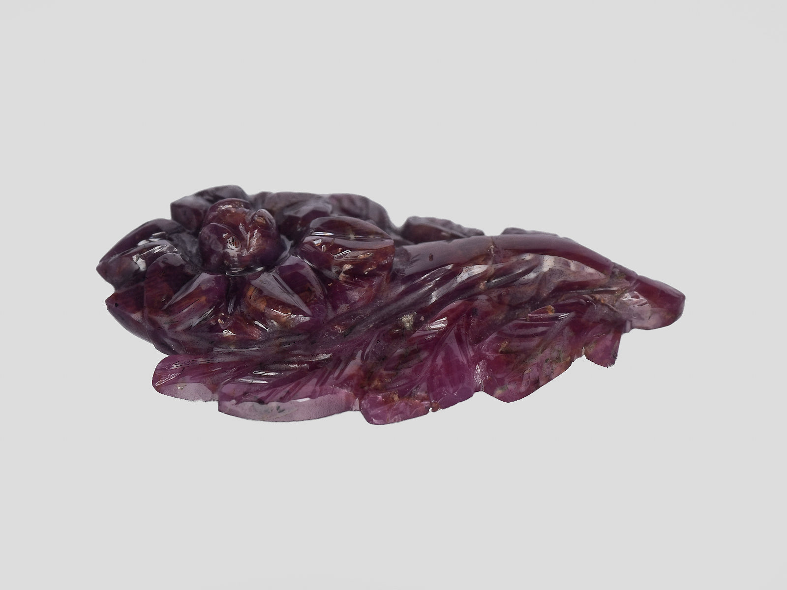 8801544-carved-dark-purple-red-gii-liberia-natural-ruby-28.30-ct