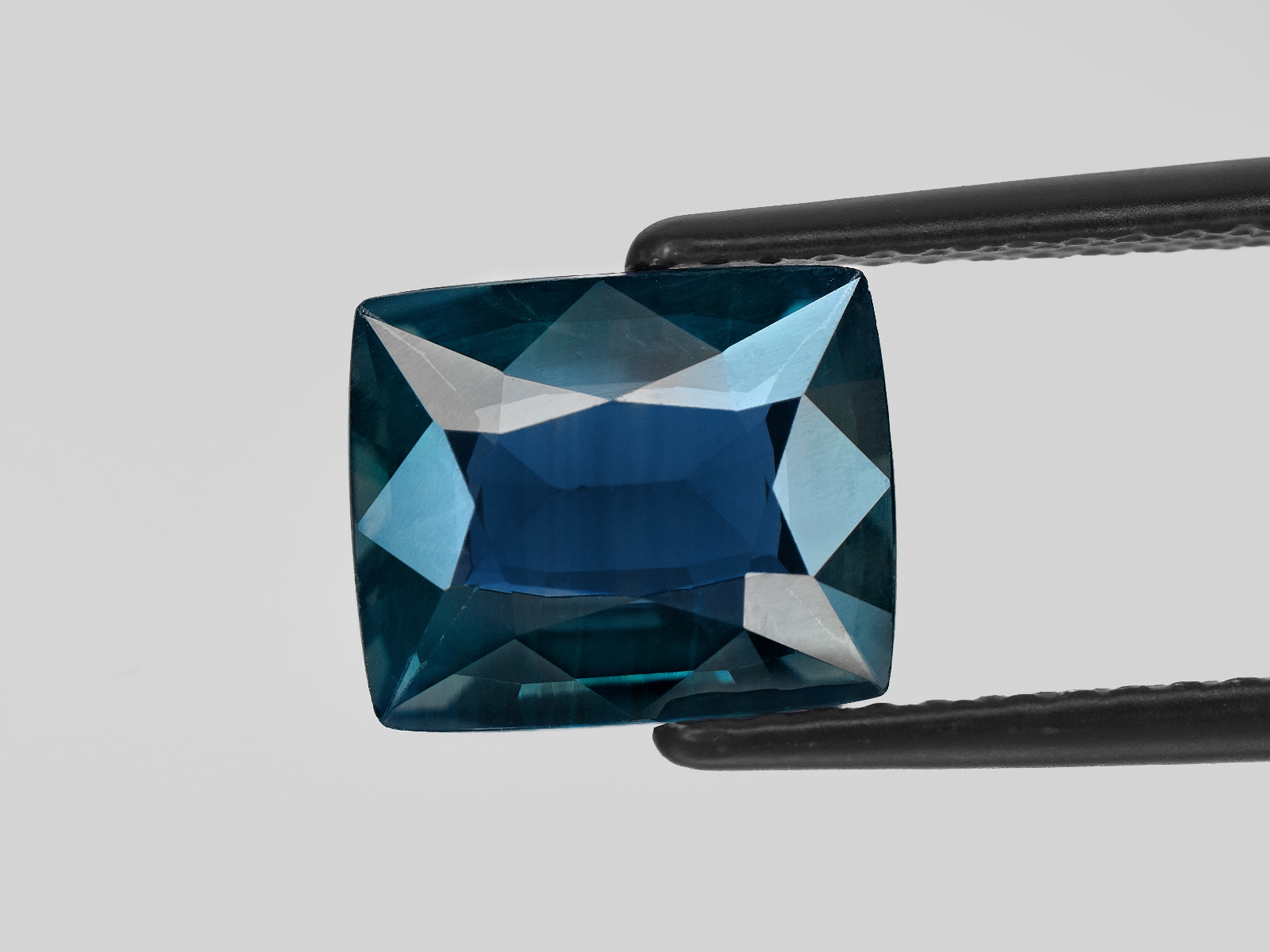 8801323-cushion-deep-greenish-blue-gia-nigeria-natural-blue-sapphire-4.02-ct