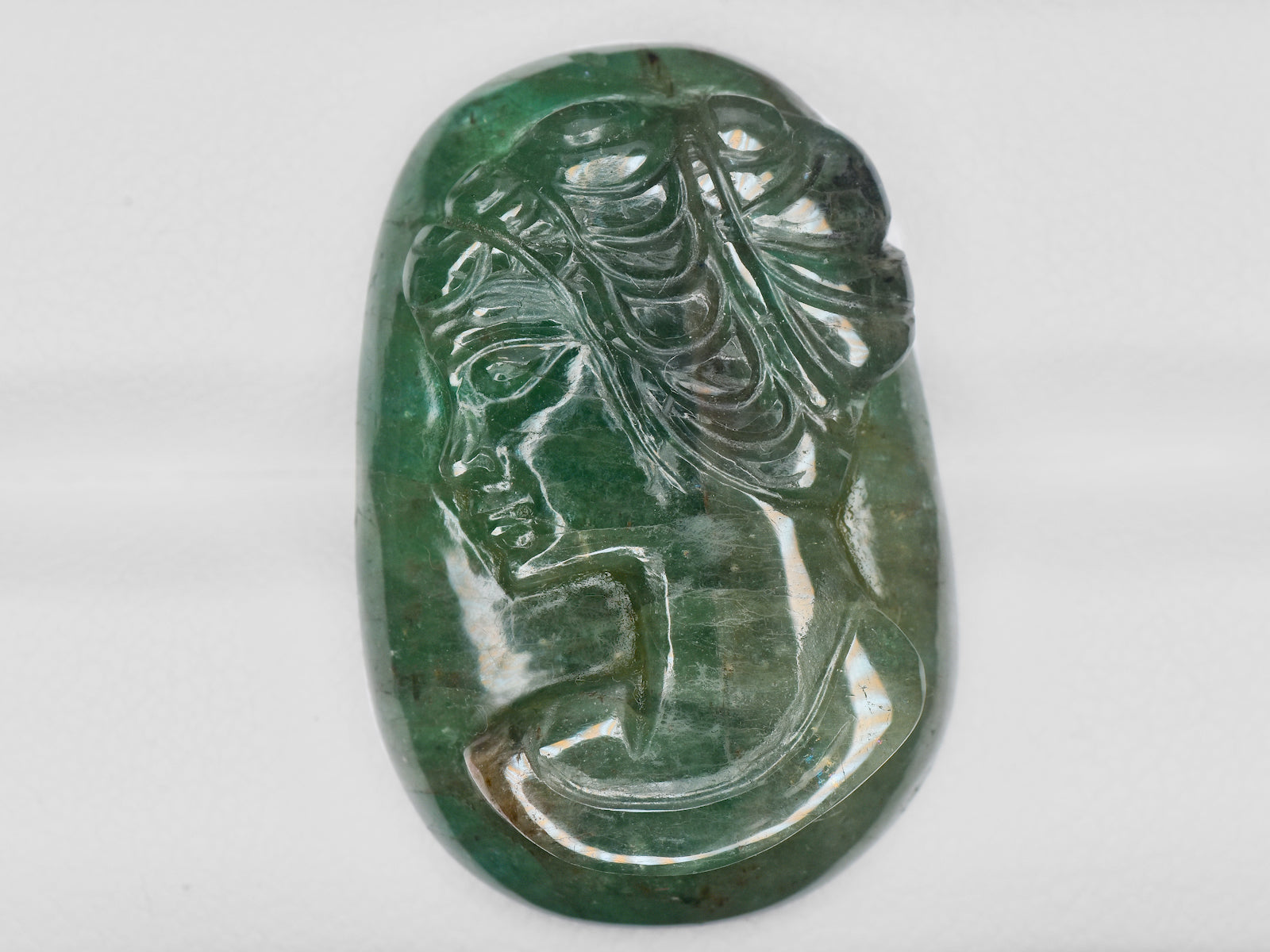 8801469-carved-intense-green-gii-zambia-natural-emerald-32.56-ct