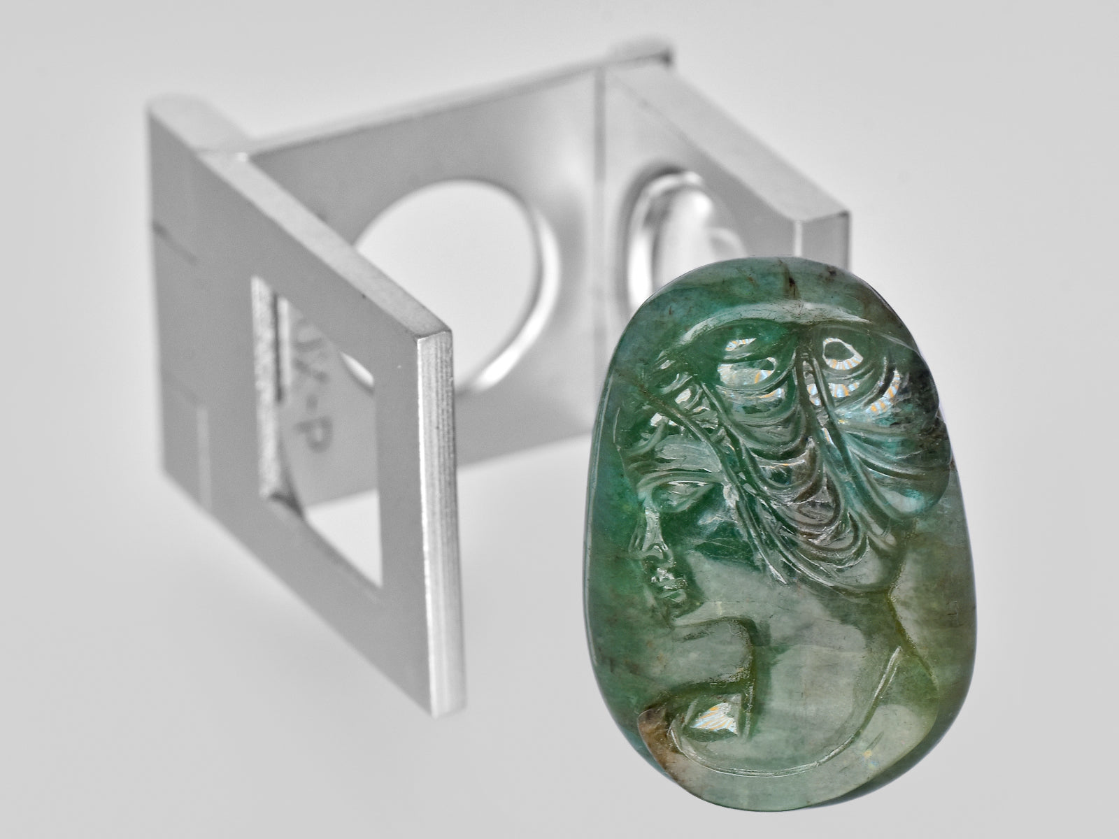 8801469-carved-intense-green-gii-zambia-natural-emerald-32.56-ct