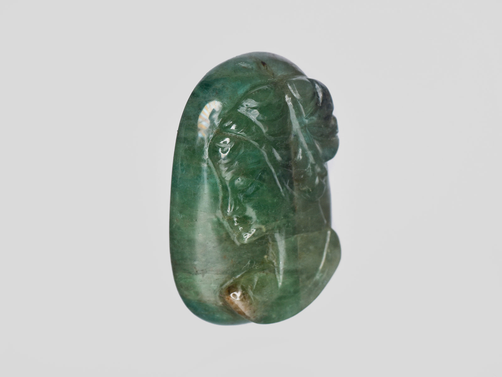 8801469-carved-intense-green-gii-zambia-natural-emerald-32.56-ct