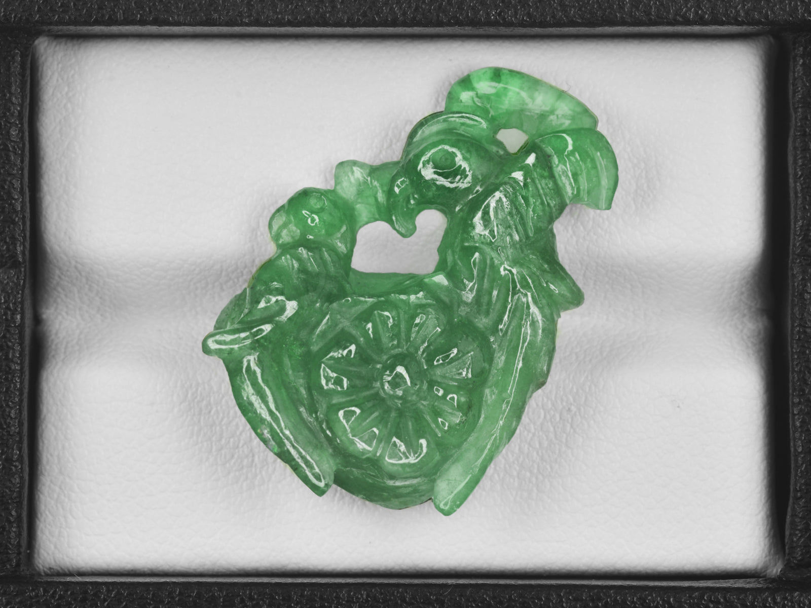 8801470-carved-bright-green-gii-zambia-natural-emerald-21.11-ct