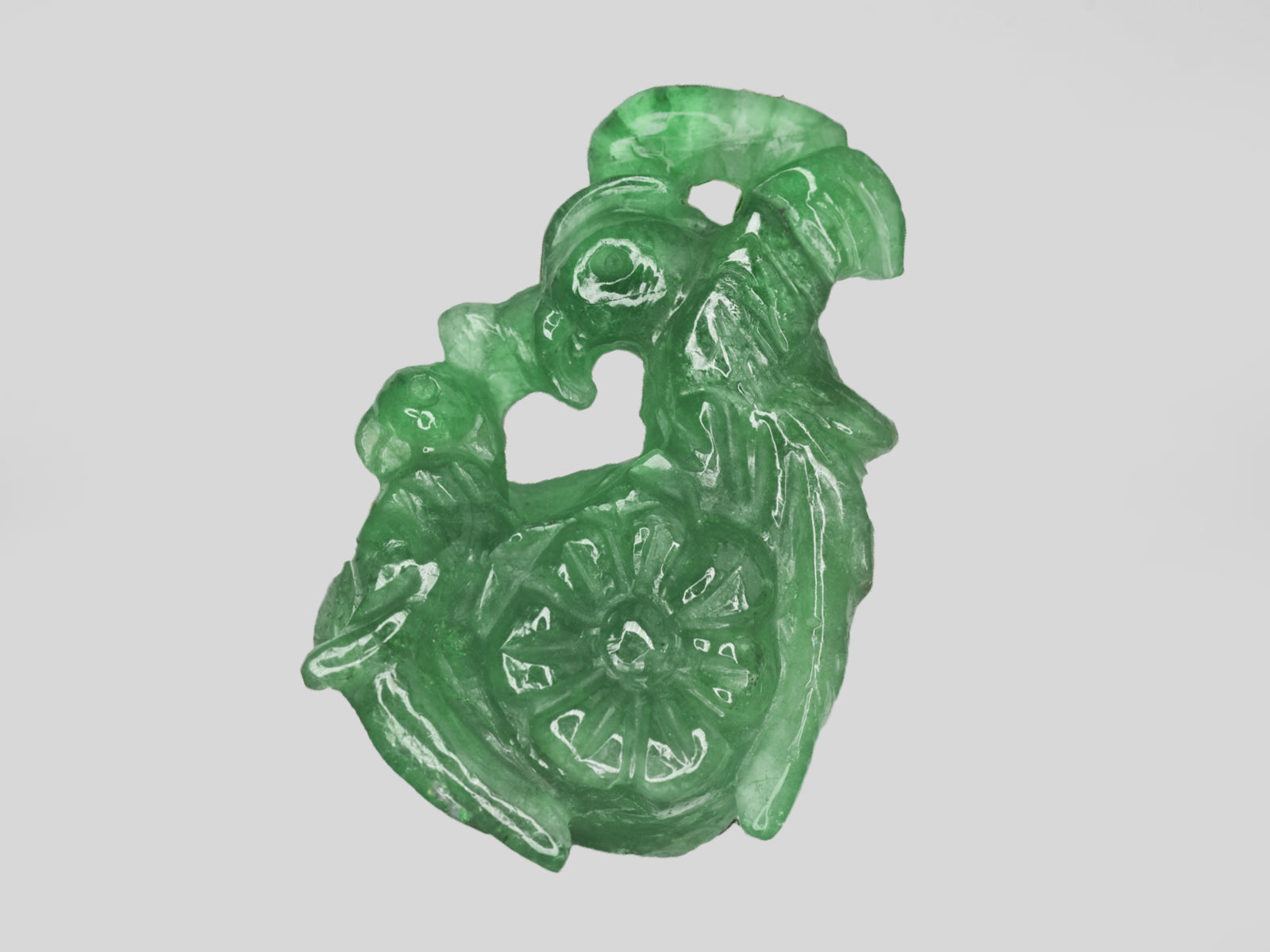 8801470-carved-bright-green-gii-zambia-natural-emerald-21.11-ct