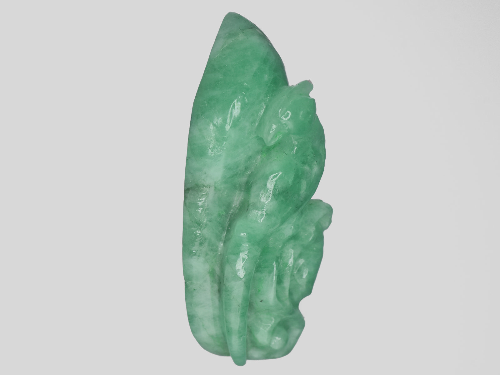 8801471-carved-light-green-gii-zambia-natural-emerald-15.15-ct