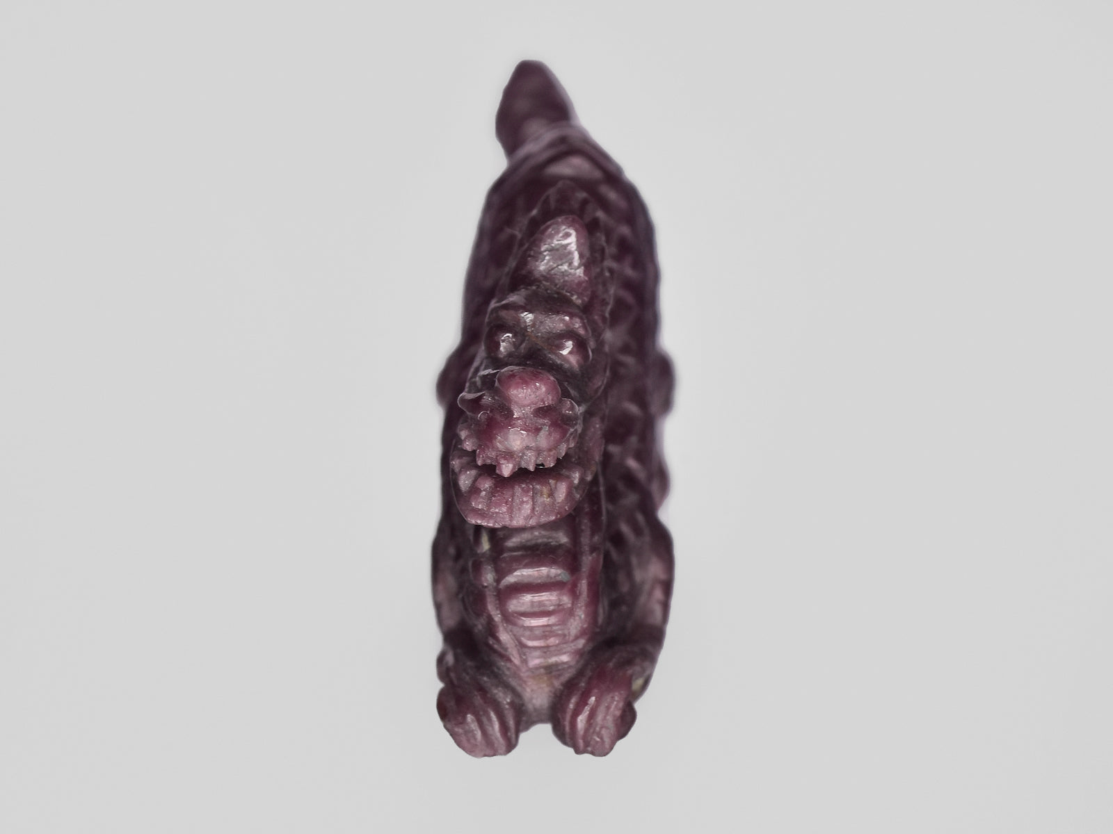 8801472-carved-dark-purple-red-gii-india-natural-ruby-61.87-ct