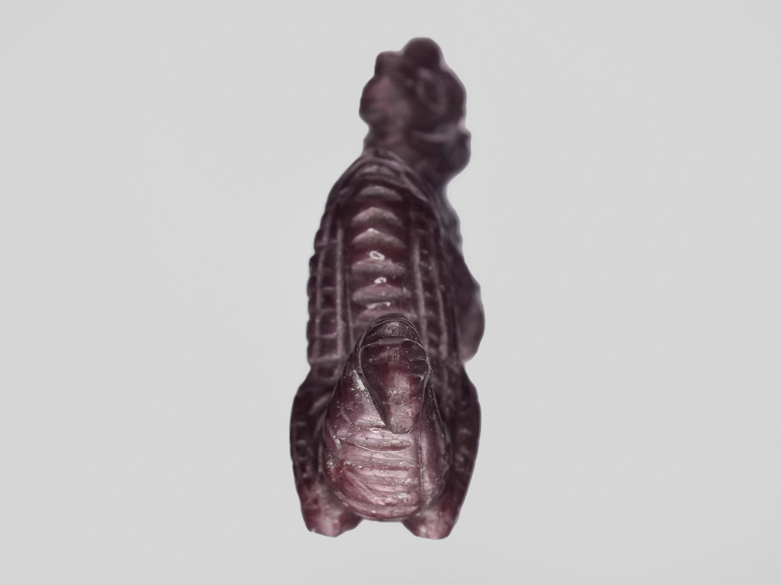 8801472-carved-dark-purple-red-gii-india-natural-ruby-61.87-ct