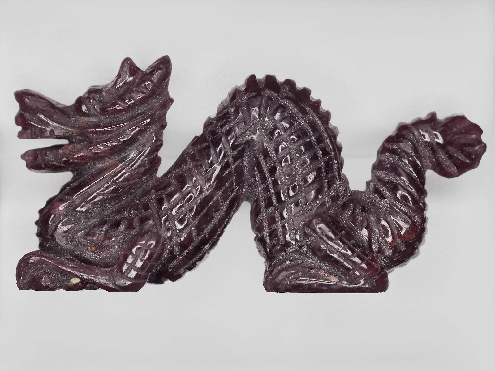 8801472-carved-dark-purple-red-gii-india-natural-ruby-61.87-ct