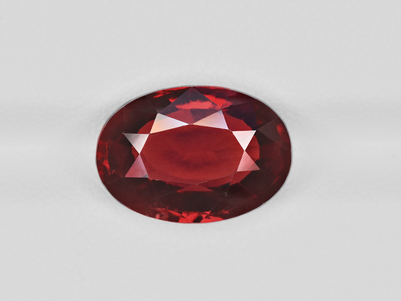 8801501-oval-deep-red-with-a-slight-brownish-hue-igi-sri-lanka-natural-hessonite-garnet-6.04-ct