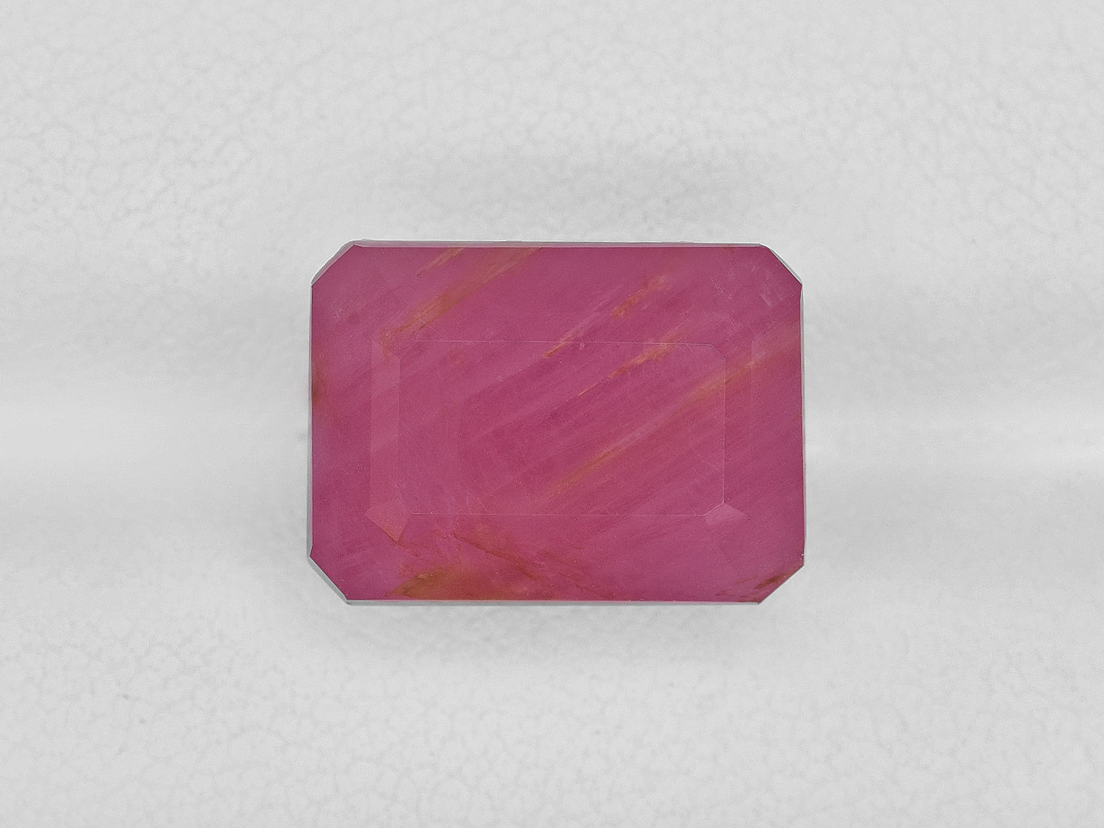 8801704-octagonal-pink-red-with-orange-staining-igi-guinea-natural-ruby-13.33-ct