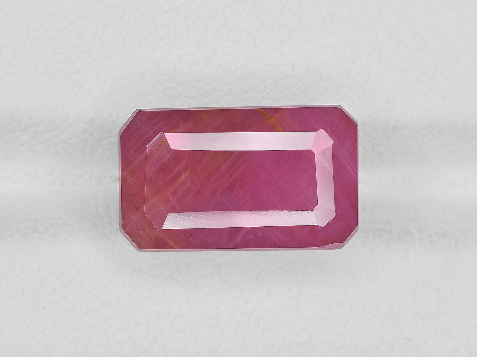 8801706-octagonal-pink-red-with-orange-staining-igi-guinea-natural-ruby-13.14-ct