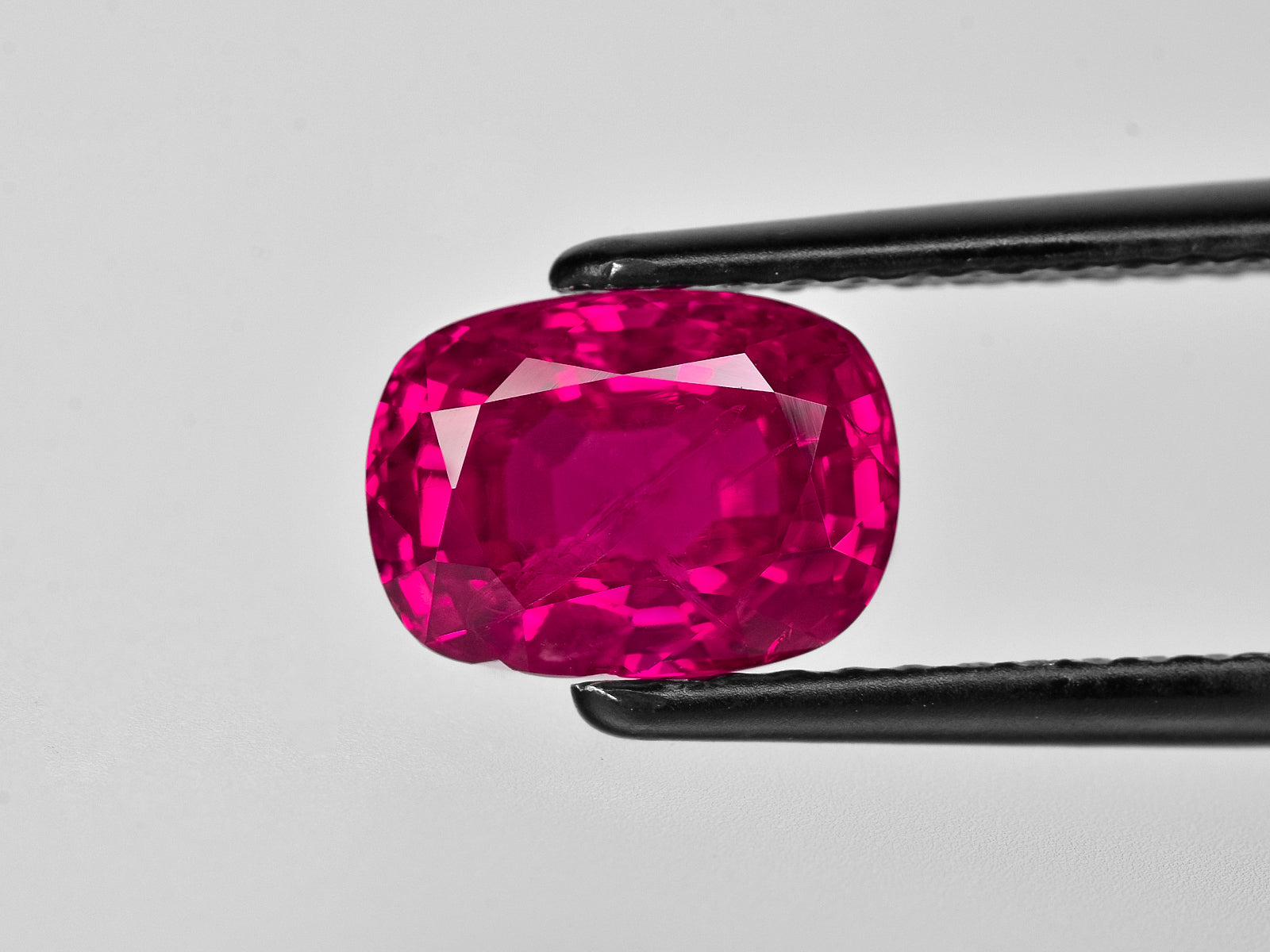 8801771-cushion-fiery-vivid-pinkish-red-gii-burma-natural-ruby-3.12-ct