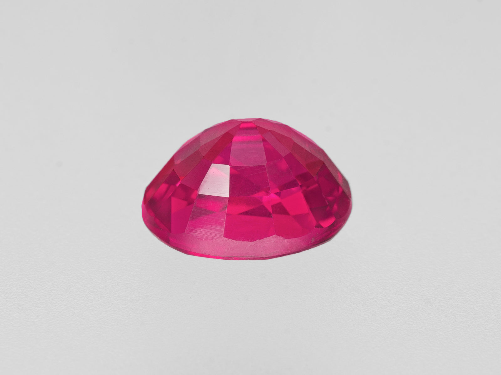 8802608-oval-fiery-neon-pinkish-red-grs-gii-mozambique-natural-ruby-1.28-ct